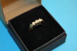 A 9ct gold diamond three stone ring.