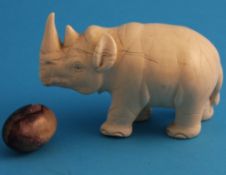 A small Blue John egg, 4 cm long, 2.5 cm wide; and a small ivory elephant, 12 cm long.