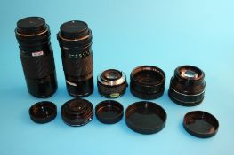 A Canon FD 200 mm 1:4 lens; a FD 70-150 mm 1:4.5 lens; an Aston Super Wider Semi Fish Eye lens;