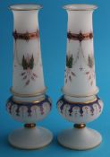 A pair of late 19th century Continental opaque glass spill vases decorated in colourful enamels