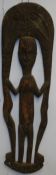 A carved African tribal sculpture of a man.120 cm long