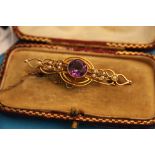 A Victorian 15ct gold amethyst and seed pearl bar brooch.