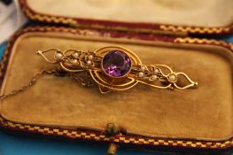 A Victorian 15ct gold amethyst and seed pearl bar brooch.
