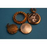 Four gold picture lockets.