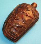 A Chinese carved horn snuff bottle decorated with fish and foliage (sealed lid).10.5 cm high6 cm
