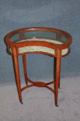 An Edwardian satinwood and painted kidney shaped bijouterie cabinet with glazed top and sides,