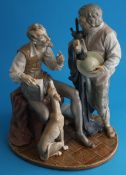 A large Lladro figural group of Don Quixote and Pallarge supported on an oval base.31cm wide x