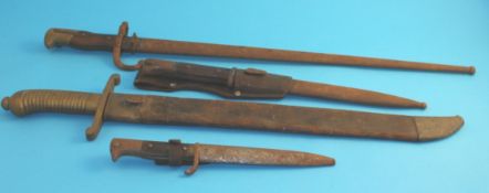 A French bayonet; a Continental gladiator short sword and two daggers. (4)