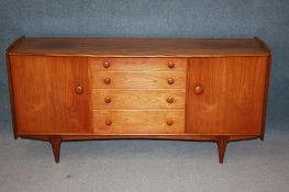 A teak Younger and Sons Ltd sideboard, drawer leaf table and four chairs.