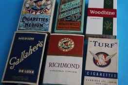 A box of miscellaneous cigarette and tea cards.