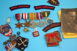 A set of World War Two medals, a dress set of medals, to include a collection of photographs and