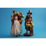 A Royal Doulton figure "Biddy Pennyfarthing" HN1843 and "The Mask Seller" HN2103. (2)