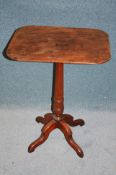 A Victorian mahogany rectangular topped tripod table.54 cm high