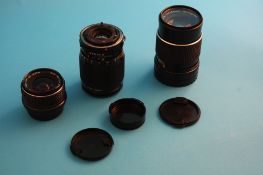 A SMC Pen tax 1:2.8 30 mm lens; a Mamiya-Sekor C 1:4 f = 150 mm lens; and a Canon lens FD 35-105
