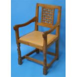 A set of 8 Robert "Mouseman" Thompson oak dining chairs with lattice work backs each with carved