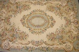 A hand embroidered European style rug, Kashmir, India, the central floral medallion with flowering