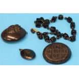 A carved oval jet pendant with carved female bust in relief, an oval brooch "In Memory Of" and an