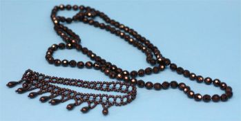 A jet coloured  beadwork choker and a double necklace. (2)