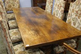 A Good heavy Titchmarsh and Goodwin oak refectory table with large and heavily carved cup and