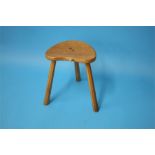 A Robert "Mouseman" Thompson heart shaped stool with carved mouse to the front and supported on