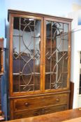 A Georgian mahogany secretaire bookcase with astragal glazed door below a secretaire drawer above