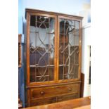 A Georgian mahogany secretaire bookcase with astragal glazed door below a secretaire drawer above