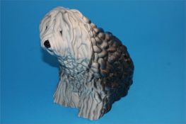 A Beswick figure of a seated Old English Sheepdog, impressed number 453 and printed mark.