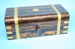 A Victorian Coromandel wood and brass banded writing slope opening to reveal a tooled gilt leather