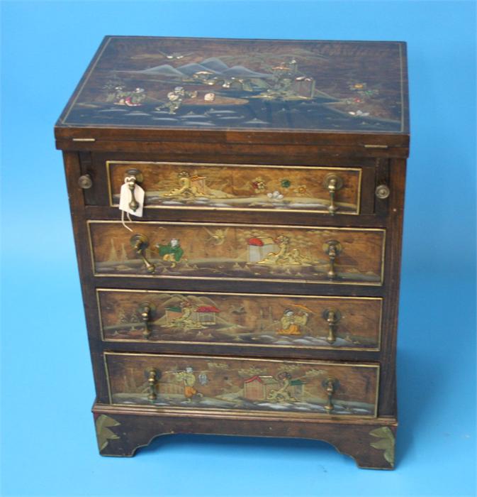 A small oriental lacquered bachelor's chest, the top folds over to reveal a leather inset below 4