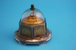 An American "Mova" desk-top barometer in a perspex domed case circa 1930's; and a curling stone