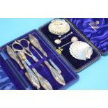 A cased set of two silver shell salts and spoons, Chester 1893, and a silver handled manicure set.