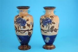 A near pair of Royal Doulton Slaters patent vases decorated with autumnal leaves and chrysanthemums,