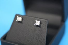 A pair of 9ct white gold diamond earrings, total weight 0.50 carats, colour G/H and clarity I2 (with