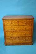 A Victorian satinwood straight front chest of drawers with 2 short and 3 long graduated drawers