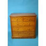 A Victorian satinwood straight front chest of drawers with 2 short and 3 long graduated drawers