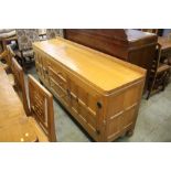 A Robert "Mouseman" Thompson oak sideboard with 3 drawers to the centre flanked by 2 panelled doors,