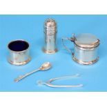 A silver three piece cruet set, Birmingham 1919 and a small pair of wishbone silver nips, Birmingham