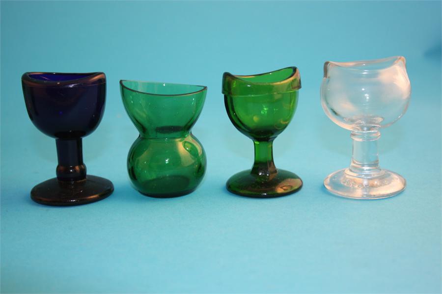 A collection of glass eye baths, seven green, one blue and 3 clear glass. (11) - Image 2 of 4