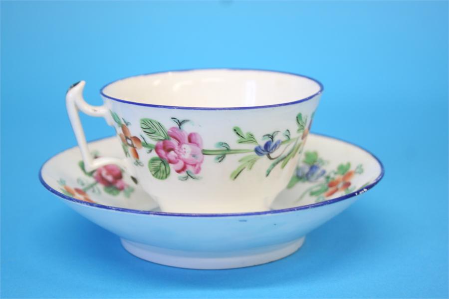 Five tea bowls and saucers and a spare bowl, each decorated with a sprig of flowers, 4 cups and - Image 3 of 5