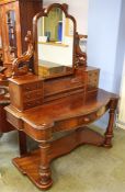 A Victorian mahogany duchess dressing table the back with central mirror flanked by 6 drawers, below