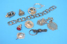 A bag of silver fobs, various jewellery etc.