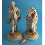 A pair of continental bisque porcelain figures of a gallant and a lady; supported on stepped