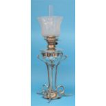 A Hinks silver plated Art Nouveau style oil lamp with frosted shade, below a shaped base,