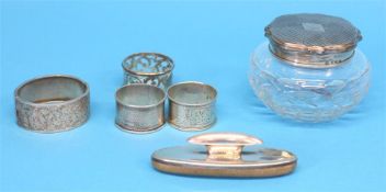 A silver top dressing table bottle, a silver bangle, 3 silver napkins rings.  Weight 122.5 grams/3.9