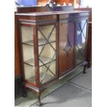 An Edwardian mahogany china cabinet supported on claw and ball feet.  134 cm wide