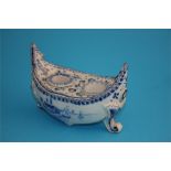 A Dutch Delft blue and white boat shaped inkstand decorated with a windmill and sailing ships