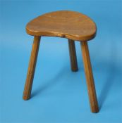 A Robert "Mouseman" Thompson heart shaped stool with carved mouse to the front and supported on