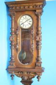 A large walnut cased double weight Vienna regulator clock with cream dial, 8 day movement, second