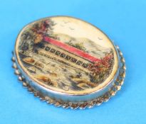 An oval brooch decorated with New England Bridge Massachusetts, USA.