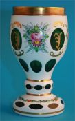 A Victorian glass vase on pale pink ground decorated with enamelled flowers and a modern Bohemian